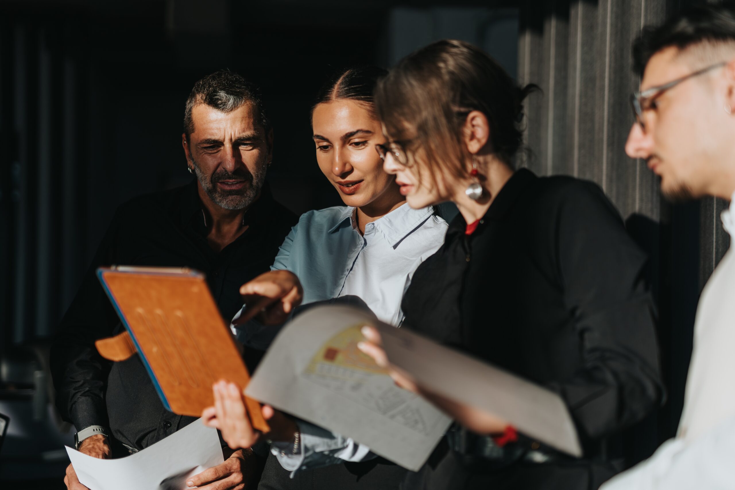 A group of direct marketers collaborating together.