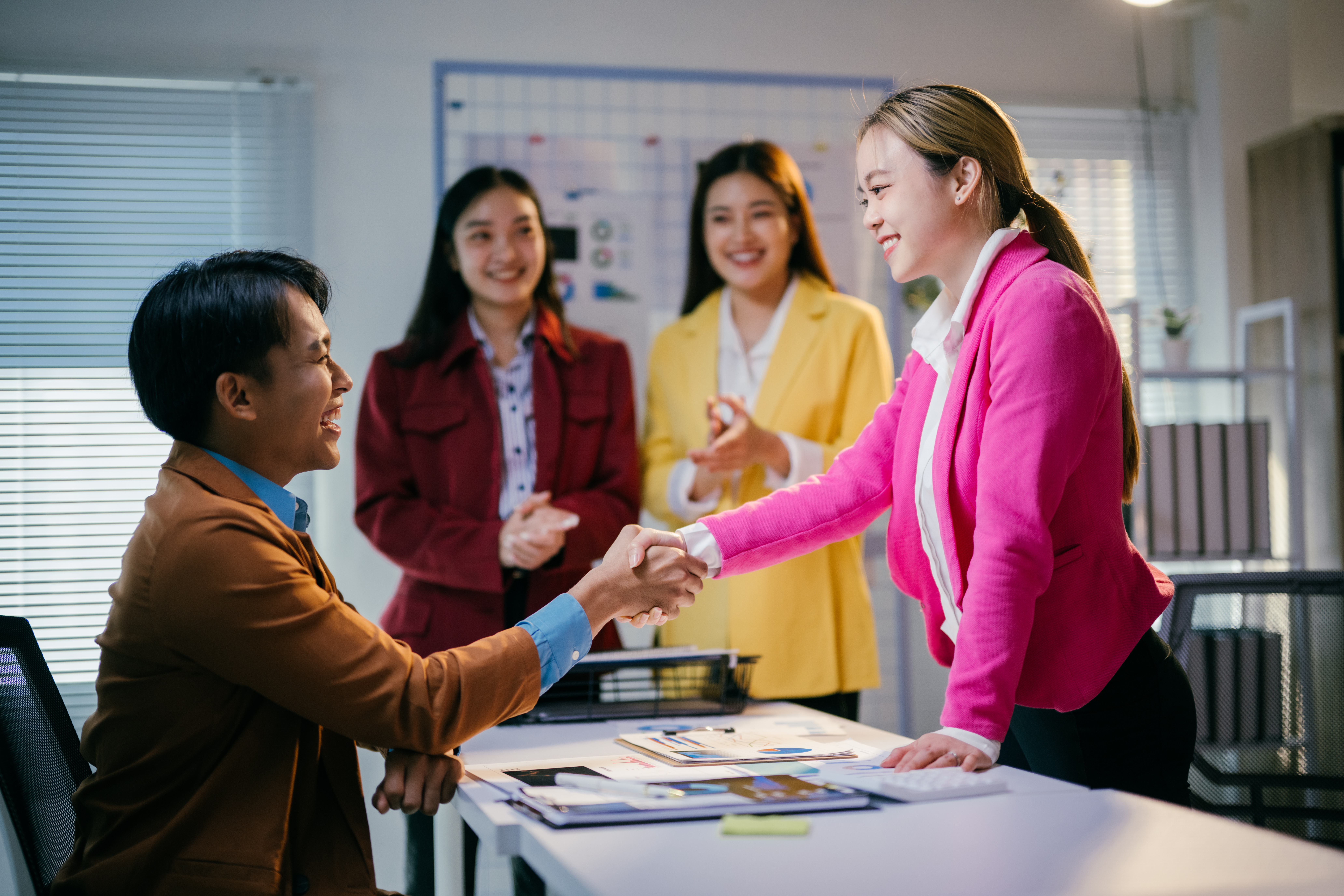 A female employee accepting a job promotion.